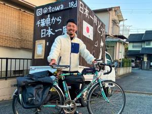 日本1周を達成した城間さんの写真