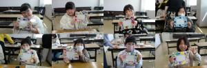 作品を持っている子どもたちの写真